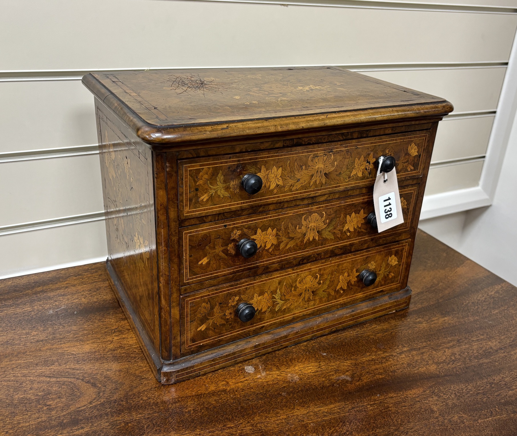 A Victorian floral marquetry inlaid miniature walnut chest, stamped 1863, B Shepherd, width 35cm, depth 24cm, height 27cm